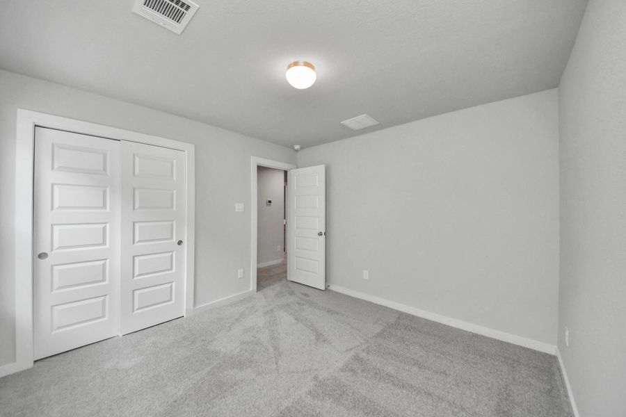 Generously sized secondary bedrooms, complete with spacious closets and soft, inviting carpeting. Enjoy abundant natural light streaming in through the large windows, complemented by privacy blinds for your personal sanctuary. Generously sized secondary bedrooms, complete with spacious closets and soft, inviting carpeting. Enjoy abundant natural light streaming in through the large windows, complemented by privacy blinds for your personal sanctuary.