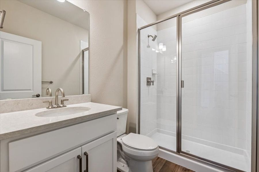 A bathroom with a glass shower.