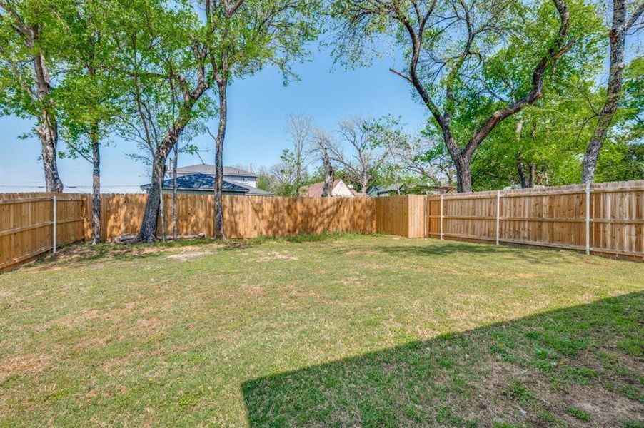 View of fenced backyard