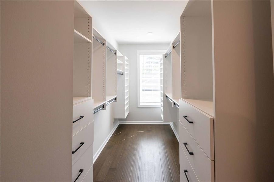 Beautiful walk in closet with solid shelving available as an option. *Please note that pictures shown are of the Jacobsen II floorplan but they are not of the actual home listed.