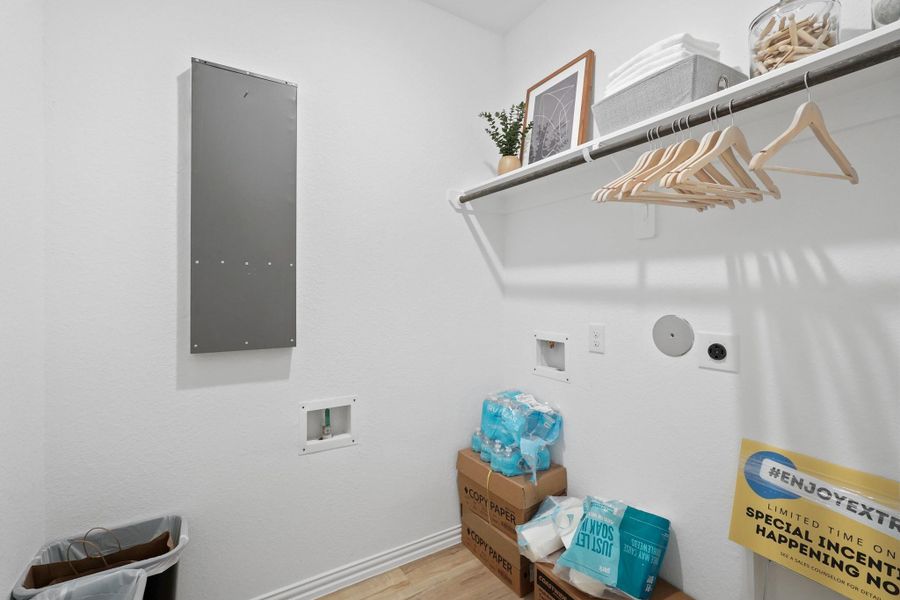 The utility room is well-lit and roomy, providing storage for cleaning supplies, laundry, and household necessities. Its practical layout and durable materials make it an essential, easy-to-use space for family life.