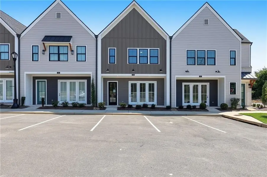 Front exterior of a new home in , Braselton, GA, highlighting curb appeal (Image 31).