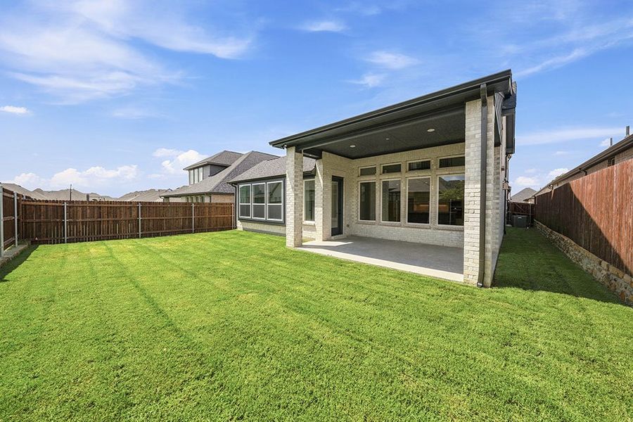 Exterior details and patio area of a home in Tavolo Park, Fort Worth (Image 4).