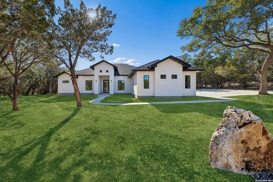 Front exterior of a new home in , Spring Branch, TX, highlighting curb appeal (Image 31).