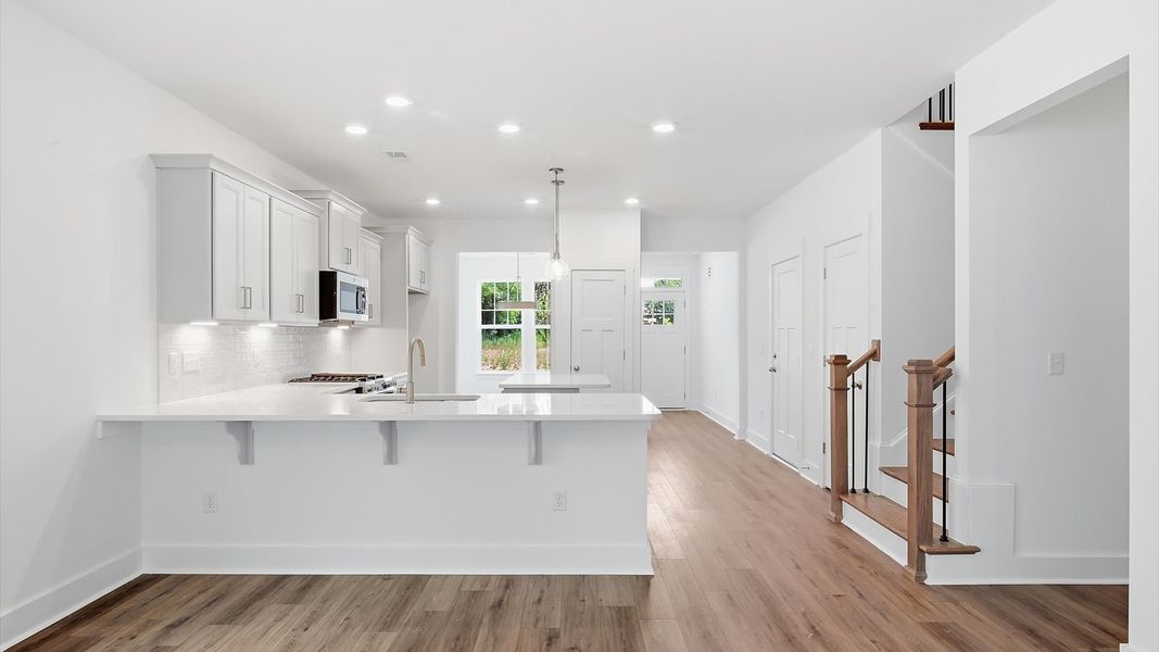 First-class finishes and a thoughtfully scaled island highlight this elegant kitchen space First-class finishes and a thoughtfully scaled island highlight this elegant kitchen space