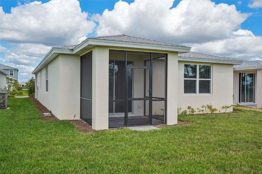 Exterior details and patio area of a home in Crescent Lakes - Premier Series, Punta Gorda (Image 20).