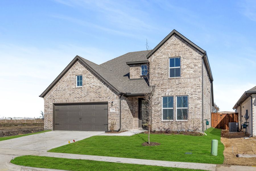 Representative exterior photo of a completed home built from the Freedom by Rockwell Homes in Creekside, Royse City, TX (Image 25).