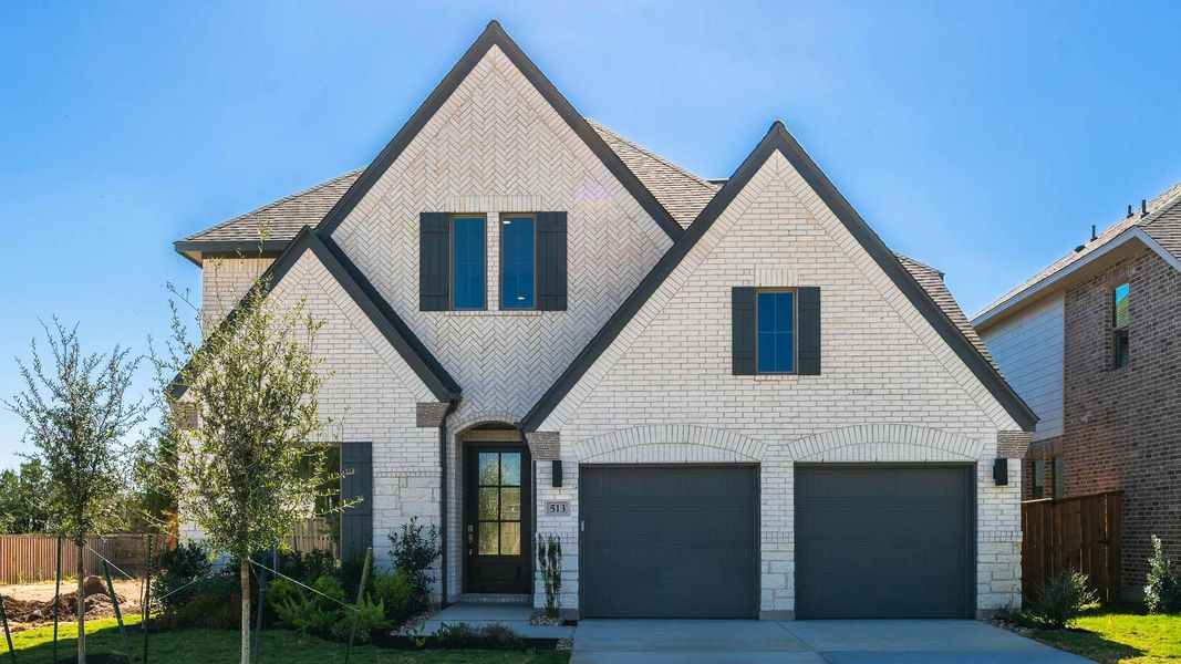 Front exterior of a new home in Parmer Ranch 50', Georgetown, TX, highlighting curb appeal (Image 1).
