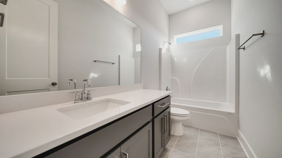Vanity sink, toilet, and shower. Vanity sink, toilet, and shower.