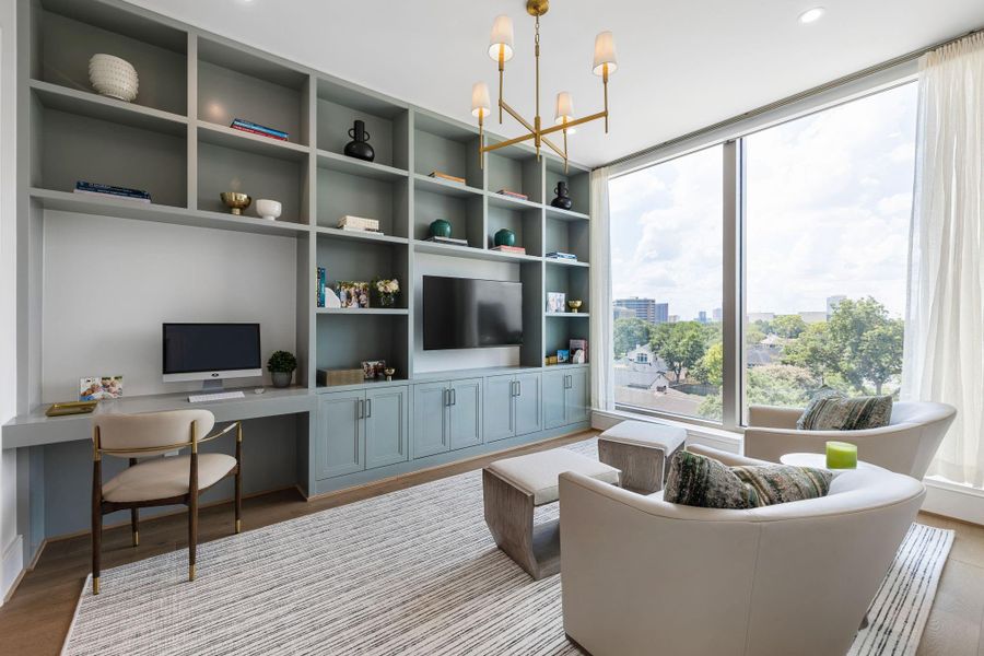 Guest bedroom has en-suite bath. Also. an option for a home office with custom and up-grade wall of book shelves.
