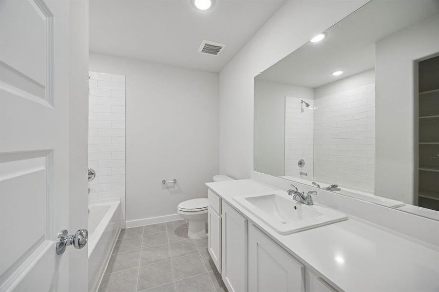 Bathroom in the Oak II home plan by Trophy Signature Homes – REPRESENTATIVE PHOTO