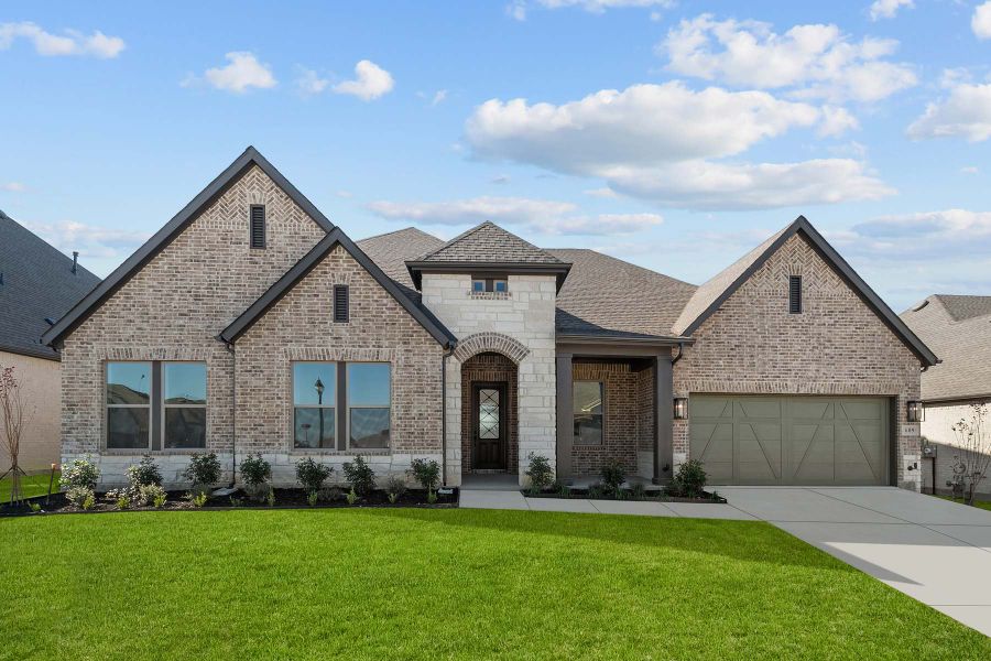 Representative exterior photo of a completed home built from the The Jaiden by David Weekley Homes in South Pointe Manor Series, Mansfield, TX (Image 1).