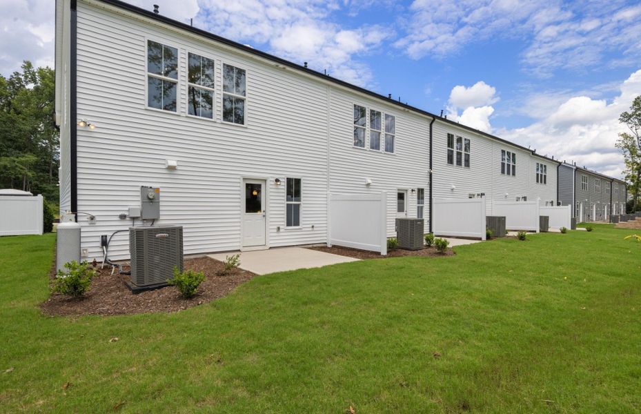 Exterior details and patio area of a home in Poets Walk, Whitsett (Image 3).