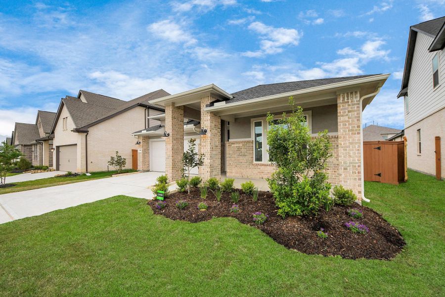 Front exterior of a new home in 50' Traditional Homes at Elyson, Katy, TX, highlighting curb appeal (Image 22). Front exterior of a new home in 50' Traditional Homes at Elyson, Katy, TX, highlighting curb appeal (Image 22).