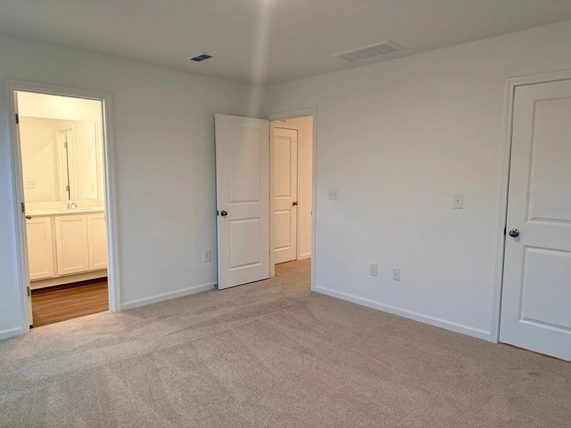 Primary Bed - A sophisticated retreat with style. Primary Bed - A sophisticated retreat with style.