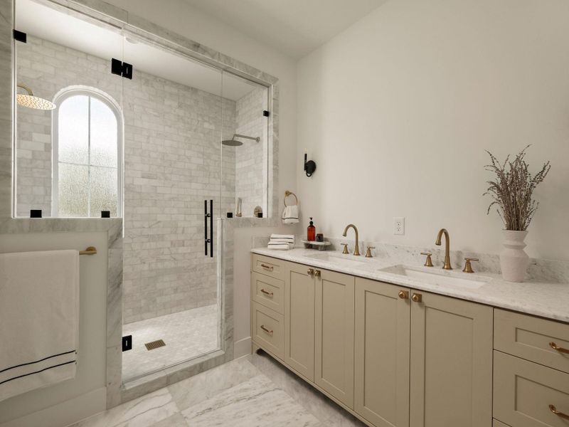 Marble finishes elevate this well-appointed bathroom with a dual vanity and glass-enclosed shower.