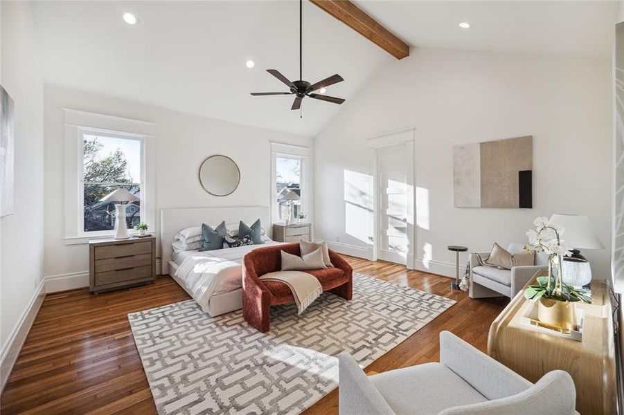 A Primary bedroom by The Modern Bungalow. 712 Byrne also has a white oak beam and a vaulted ceiling.