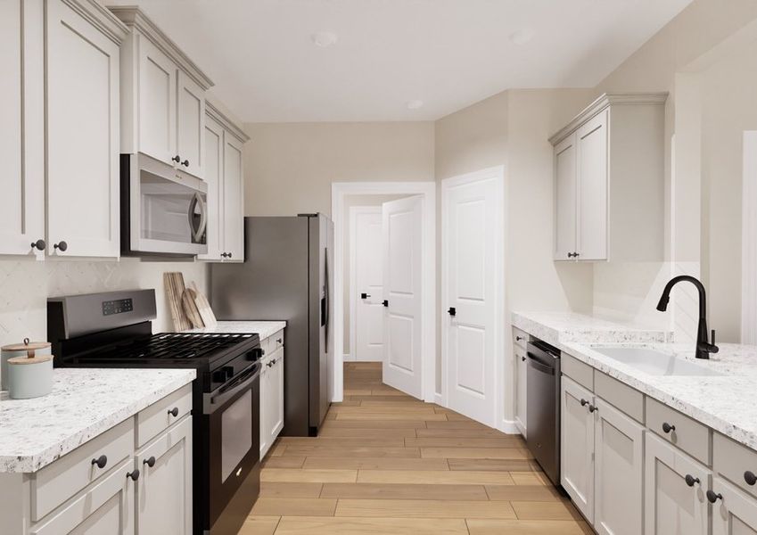 Spacious kitchen with white cabinetry, tiled backsplash, stainless steel appliances and granite countertops.
