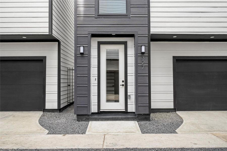 With modern finishes and fixtures inside and out, the front porch offers a welcoming entrance with an 8-foot glass panel door with internal blinds and two coach lights. The smart garage has a Q app and a separate storage room.