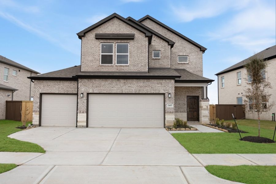 Front exterior of a new home in Creekhaven, Iowa Colony, TX, highlighting curb appeal (Image 20). Front exterior of a new home in Creekhaven, Iowa Colony, TX, highlighting curb appeal (Image 20).