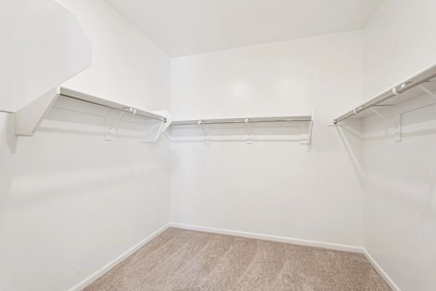 Primary walk in closet Primary walk in closet
