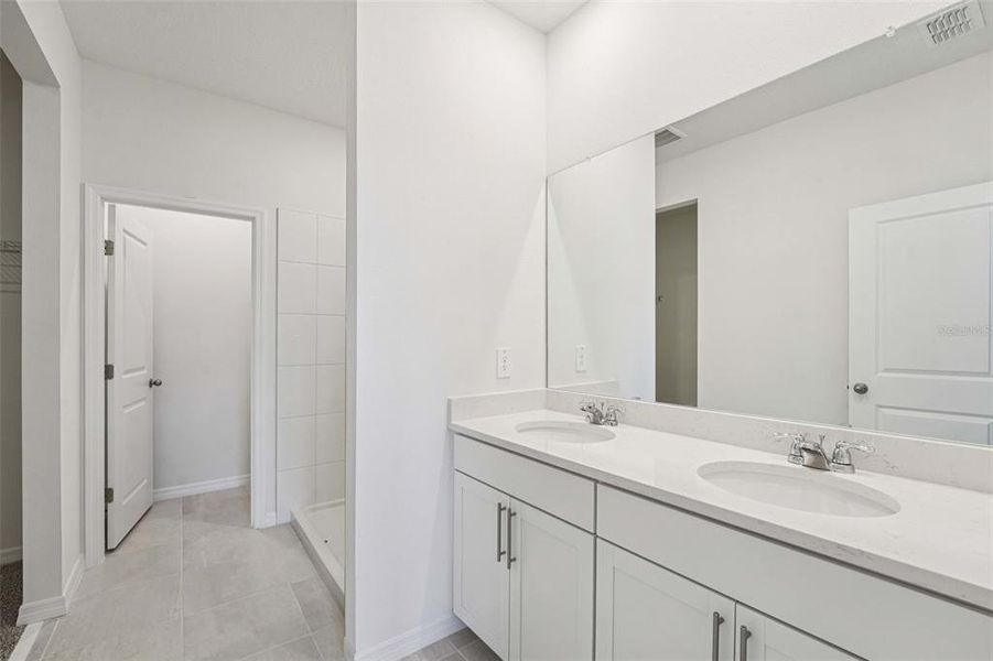 Furnished interior view inside a new home in The Grove at Stuart Crossing - Premier Series, Bartow (Image 4). Furnished interior view inside a new home in The Grove at Stuart Crossing - Premier Series, Bartow (Image 4).