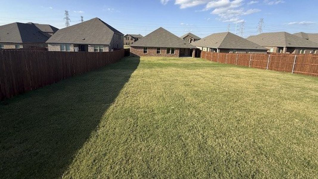 Exterior details and patio area of a home in Fireside by the Lake, Garland (Image 3).