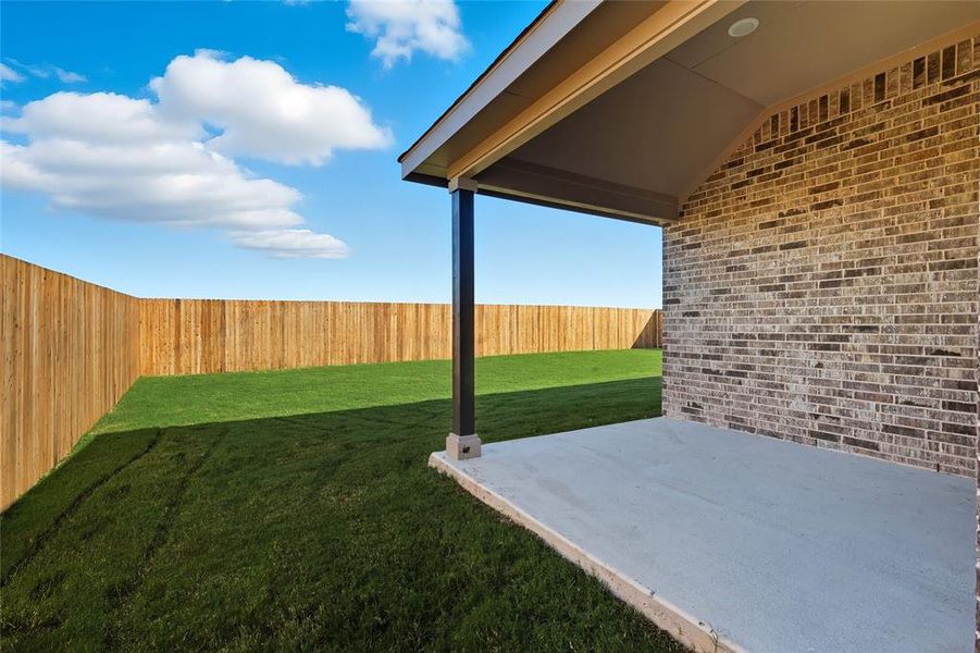 Fenced backyard with a patio Fenced backyard with a patio