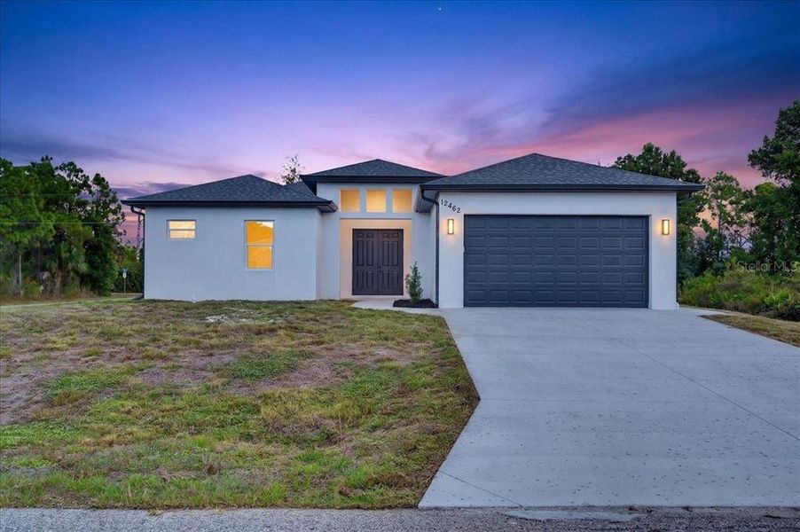 Front exterior of a new home in , Port Charlotte, FL, highlighting curb appeal (Image 1). Front exterior of a new home in , Port Charlotte, FL, highlighting curb appeal (Image 1).
