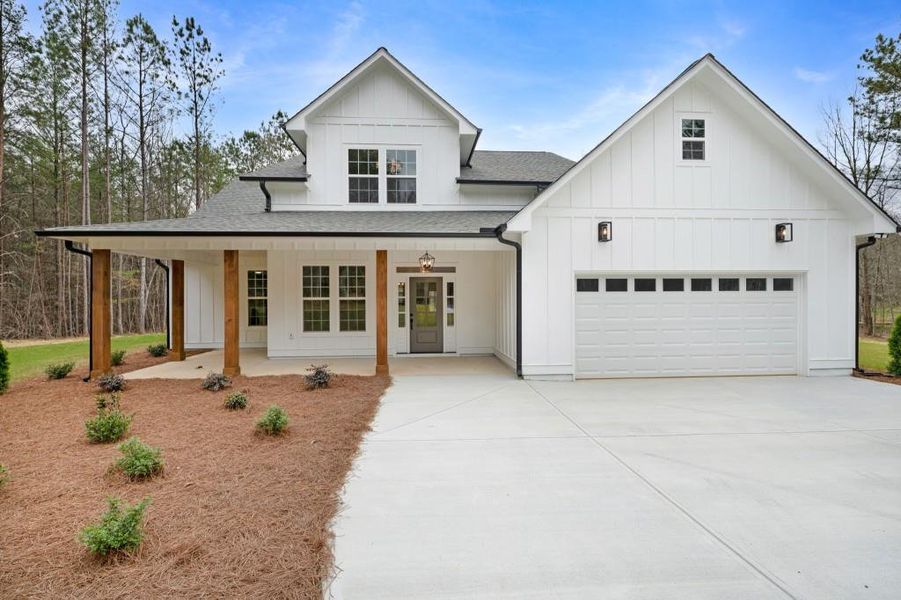 Front exterior of a new home in , Calhoun, GA, highlighting curb appeal (Image 17).