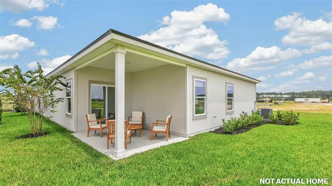 Exterior details and patio area of a home in Sawmill Branch, Palm Coast (Image 3).