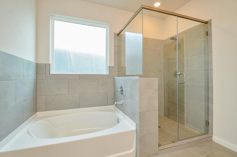 Notice the huge soaking tub and glass-door enclosed shower. Notice the huge soaking tub and glass-door enclosed shower.