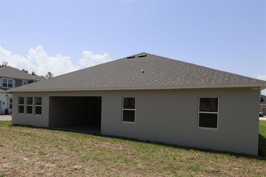Exterior details and patio area of a home in Wolf Lake Ranch, Apopka (Image 11).