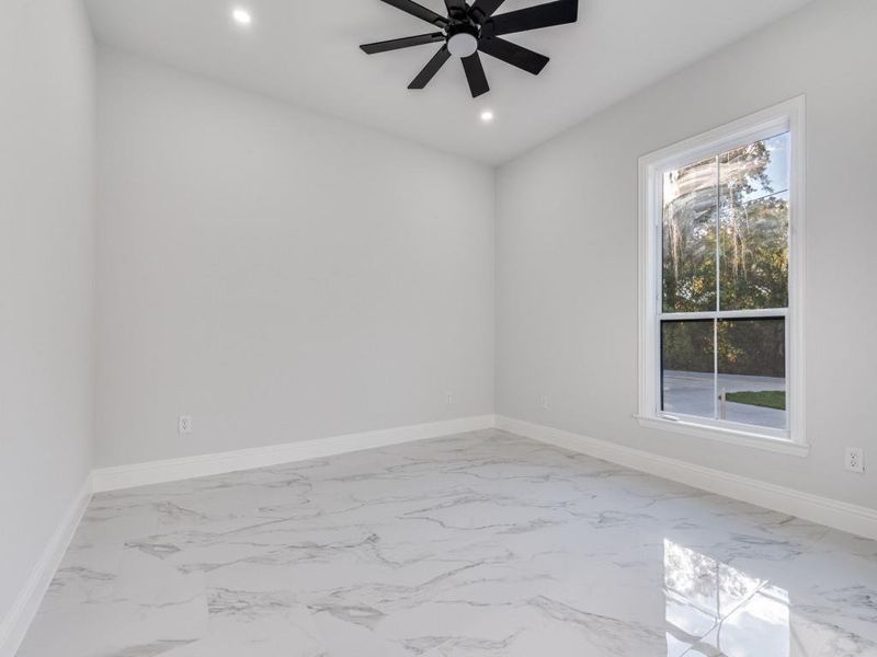 3rd  room featuring light marble finish flooring, recessed lighting, and a ceiling fan.