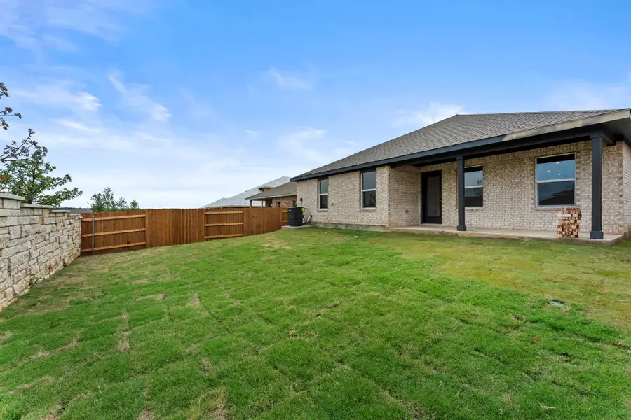 Exterior details and patio area of a home in Bar W Ranch, Leander (Image 3).