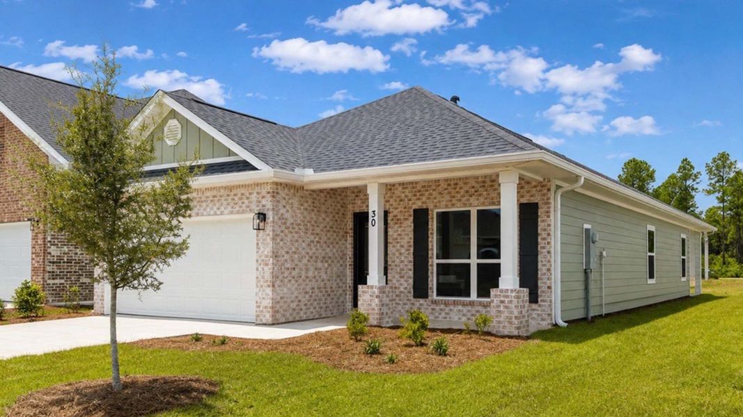 Front exterior of a new home in Ashton Park Phase III, Freeport, FL, highlighting curb appeal (Image 16).