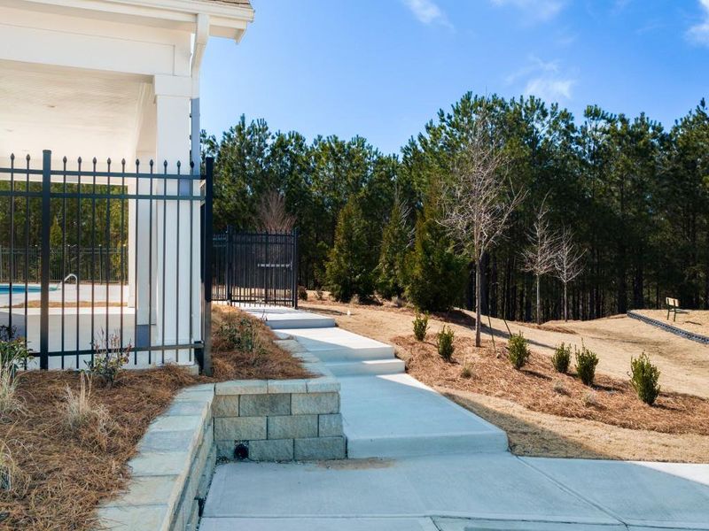 Front exterior of a new home in Oaks at Cedar Grove, Fairburn, GA, highlighting curb appeal (Image 2).