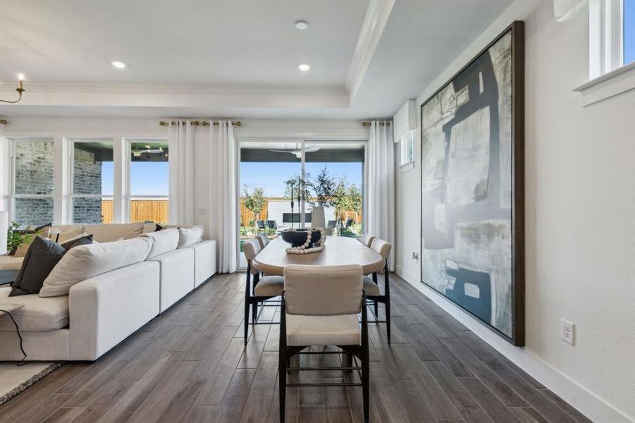 Model Representation* - Dining area off kitchen with large windows