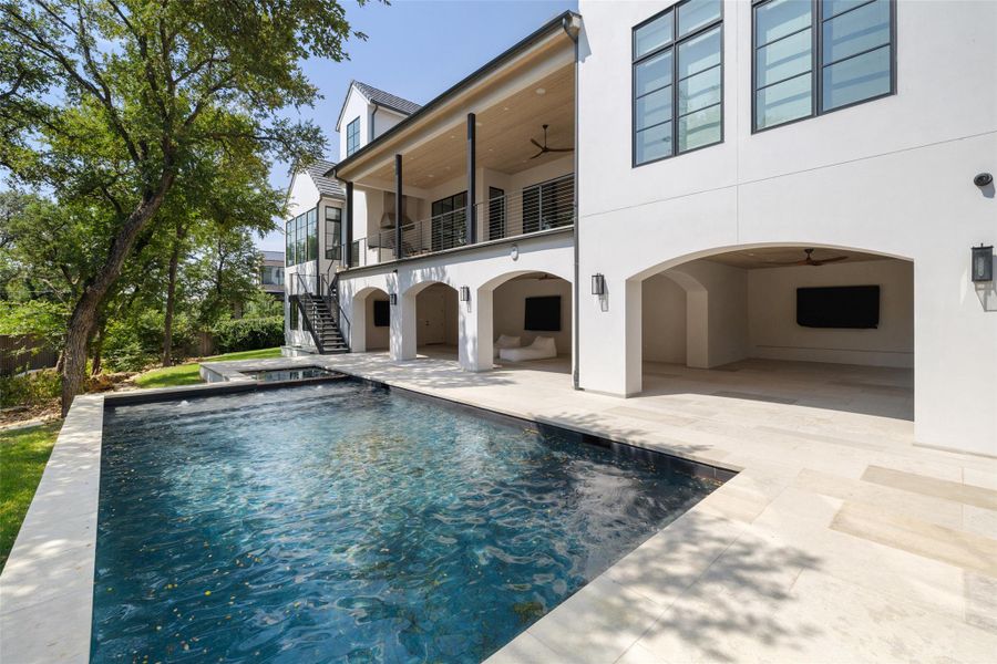 Back of house featuring a ceiling fan, stairs, a patio area, and stucco siding Back of house featuring a ceiling fan, stairs, a patio area, and stucco siding