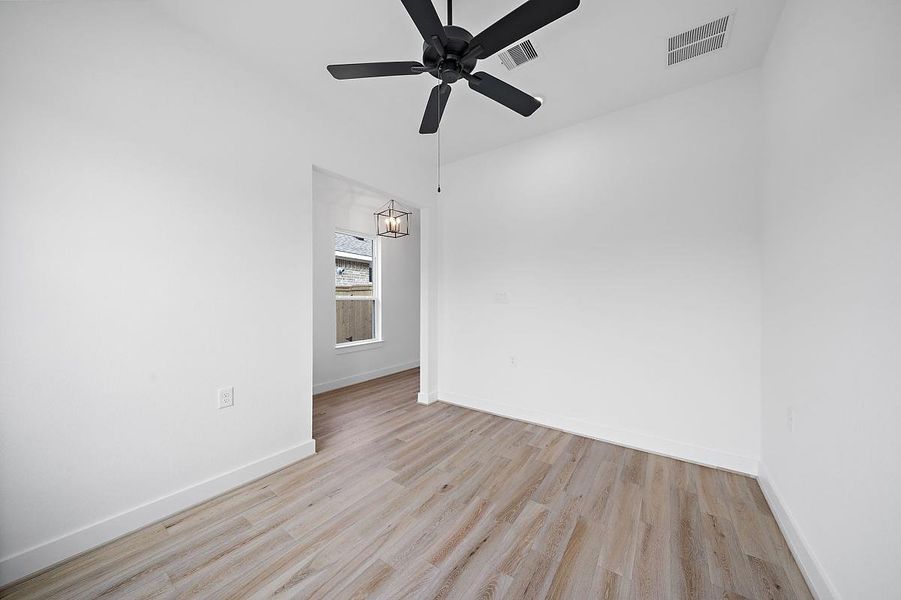 Representative unfurnished interior of a home built from the Cardinal by Caldwell Homes in Chambers Creek, Willis (Image 18).