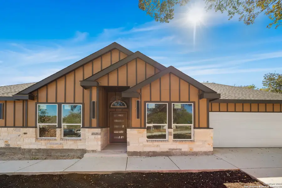 Front exterior of a new home in , Elmendorf, TX, highlighting curb appeal (Image 1).