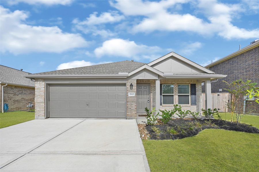 Front exterior of a new home in Samara, League City, TX, highlighting curb appeal (Image 2). Front exterior of a new home in Samara, League City, TX, highlighting curb appeal (Image 2).