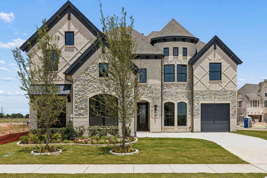 Front exterior of a new home in Grand Estates of Anna, Anna, TX, highlighting curb appeal (Image 1). Front exterior of a new home in Grand Estates of Anna, Anna, TX, highlighting curb appeal (Image 1).