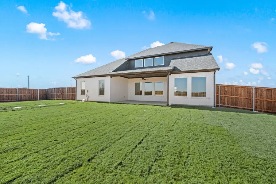 Exterior details and patio area of a home in Settlers Glen, New Fairview (Image 25).