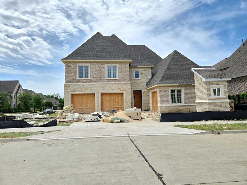 Front exterior of a new home in , Frisco, TX, highlighting curb appeal (Image 1). Front exterior of a new home in , Frisco, TX, highlighting curb appeal (Image 1).