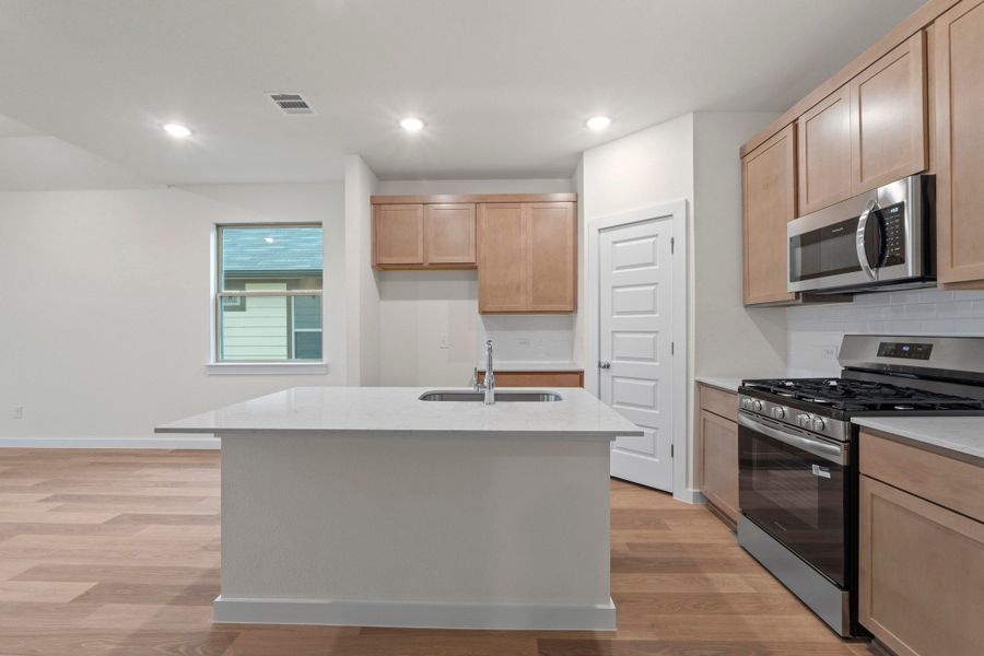 Kitchen in the Pearl home plan by Trophy Signature Homes – REPRESENTATIVE PHOTO Kitchen in the Pearl home plan by Trophy Signature Homes – REPRESENTATIVE PHOTO