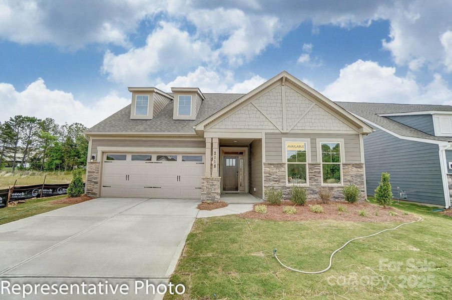 Homesite 100 features a Mayfair floorplan with a front-load garage.