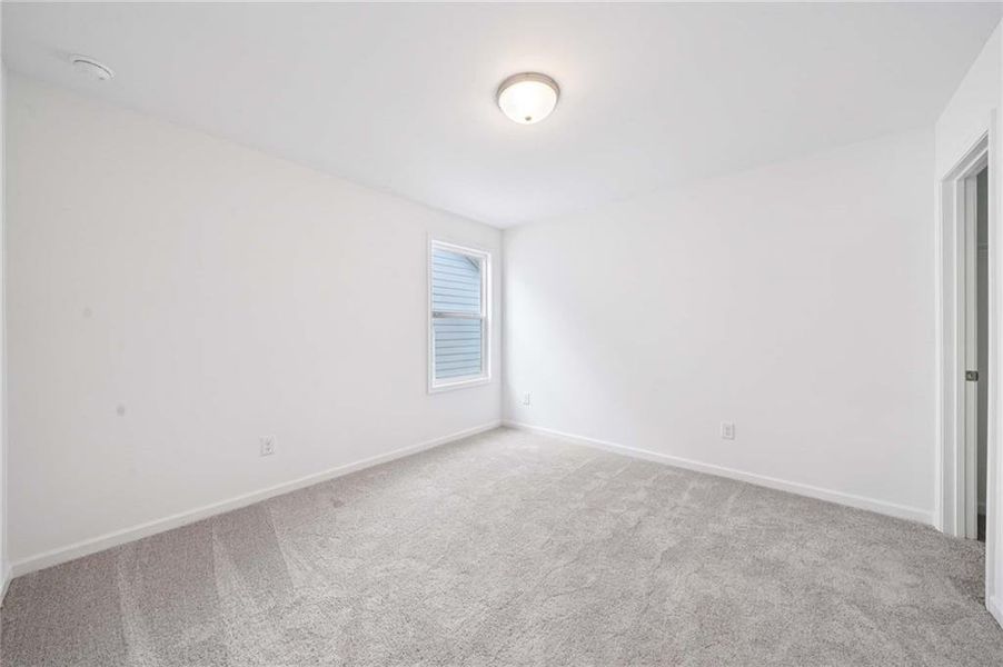 Spacious, unfurnished interior of a new home in Eastlyn Crossing, Flowery Branch (Image 17).