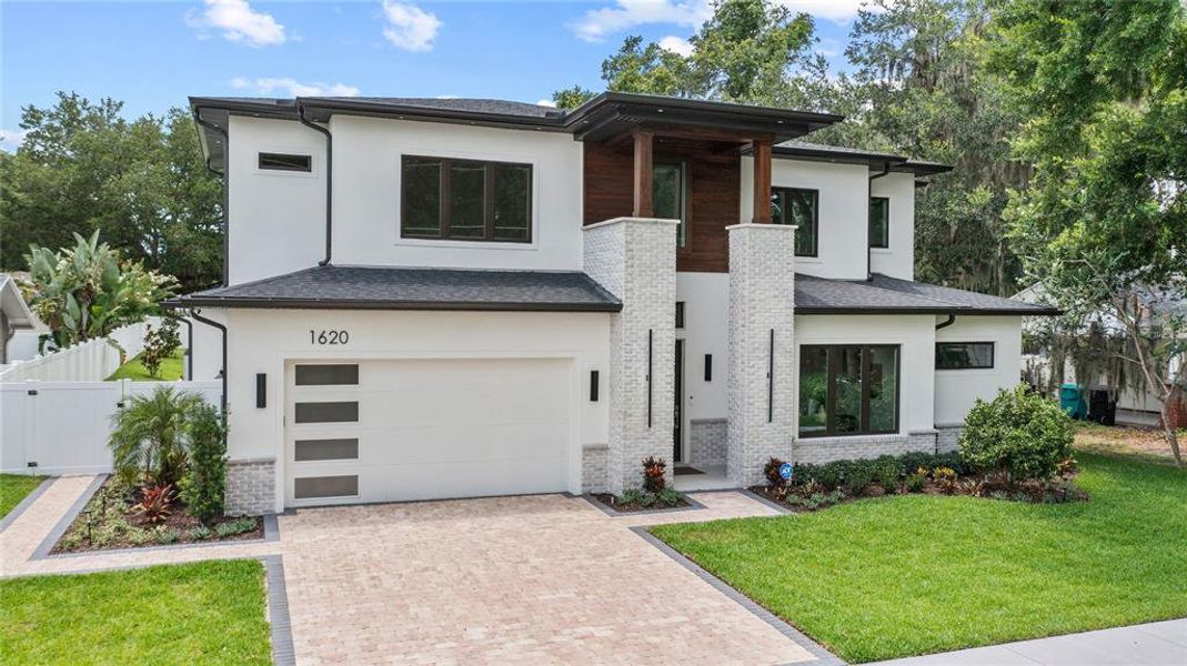 Front exterior of a new home in , Orlando, FL, highlighting curb appeal (Image 38). Front exterior of a new home in , Orlando, FL, highlighting curb appeal (Image 38).