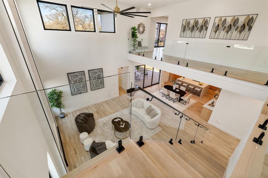 Living room with ceiling fan and wood-type flooring